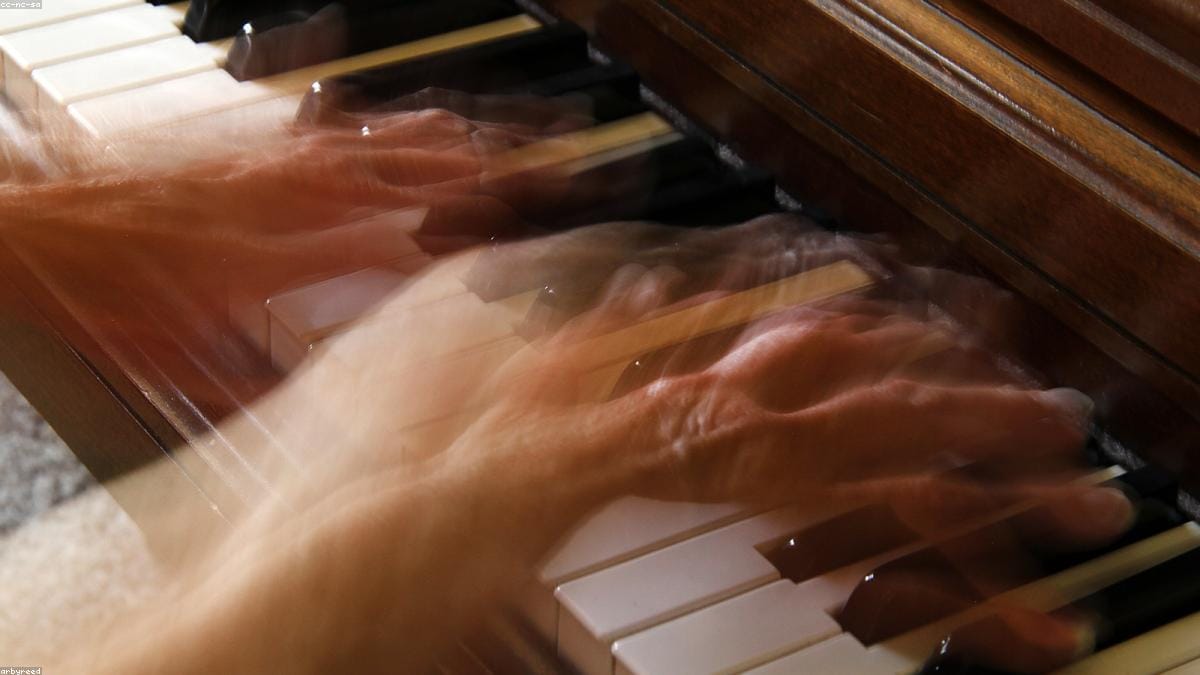 A beginner playing an easy song on the piano