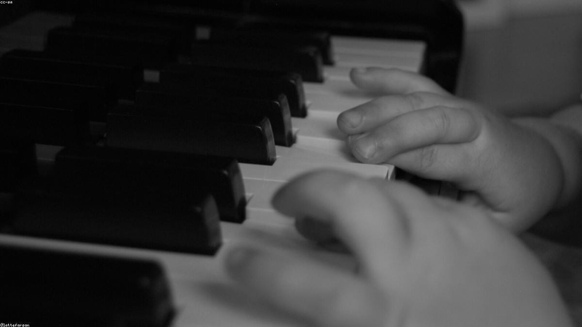A song being turned into a falling-tiles piano tutorial